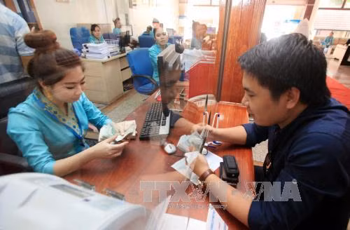 Nới biên độ tỷ giá là kịp thời và nhạy bén với thị trường ảnh 1