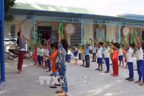 Học sinh dân tộc Chăm, trường mẫu giáo Phước Nam, huyện Thuận Nam, có ngôi trường mới khang trang để học tập trong năm học mới 2018-2019. Ảnh: Công Thử - TTXVN