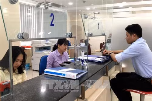 Sở Công thương Thành phố Hồ Chí Minh dành hẳn khu vực riêng để hỗ trợ doanh nghiệp và người dân thực hiện đăng ký giao dịch công trực tuyến. Ảnh: Thanh Vũ-TTXVN