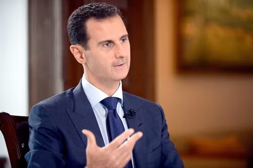 Trong ảnh (tư liệu): Tổng thống Syria Bashar al-Assad trả lời báo giới tại Damascus ngày 13/7. EPA/TTXVN