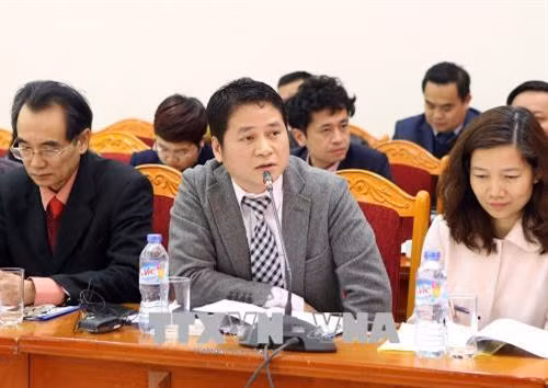Tham tán thương mại Việt Nam tại Nhật Bản Tạ Đức Minh đóng góp ý kiến tại hội nghị. Ảnh: Hoàng Hùng - TTXVN