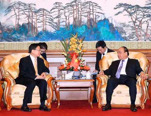 Trong chương trình chuyến thăm chính thức Trung Quốc, sáng 13/9/2016,tại Thủ đô Bắc Kinh, Thủ tướng Nguyễn Xuân Phúc tiếp Chủ tịch Ngân hàng Nông nghiệp Trung Quốc, Chu Mộ Băng. Ảnh: Thống Nhất -TTXVN