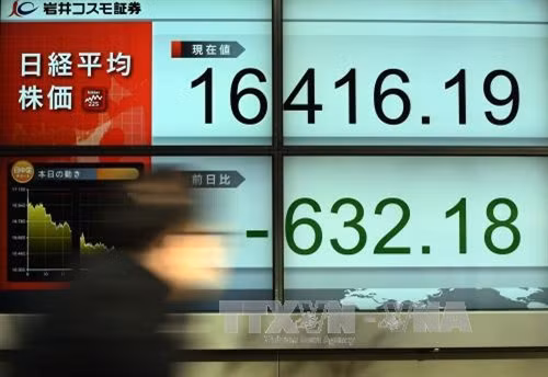 Tại thị trường chứng khoán Tokyo, Nhật Bản ngày 20/1. AFP/ TTXVN