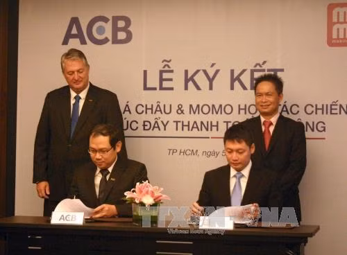 Quang cảnh buổi ký kết hợp tác chiến lược. Ảnh: Tiến Lực – TTXVN