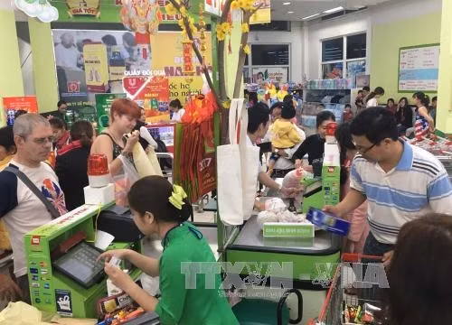 Ngày chủ nhật 22/1 tại siêu thị Big C Huế lượng khách hàng tăng lên nhiều lần so với bình thường. Ảnh: Quốc Việt - TTXVN