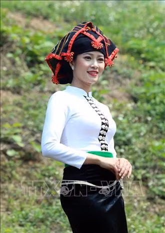 Vẻ đẹp của phụ nữ Thái khi mặc trang phục truyền thống của dân tộc. Ảnh: Phan Tuấn Anh - TTXVN