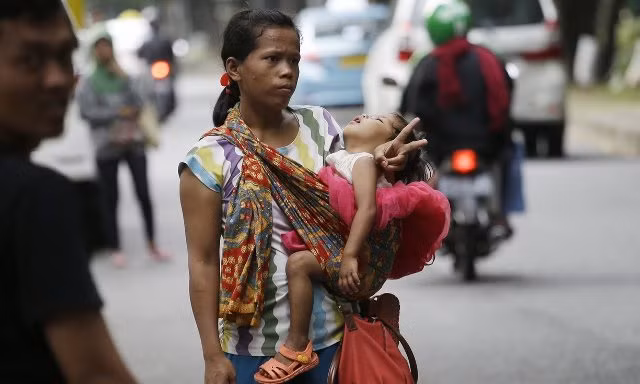 Nở rộ nghề "quá giang thu tiền" ở Indonesia ảnh 1