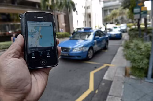 Singapore thắt chặt kiểm soát ứng dụng 'vẫy taxi' ảnh 1