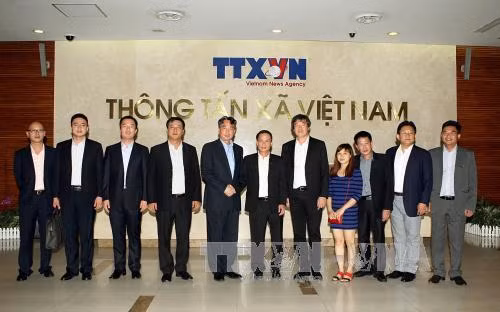 Tăng cường hợp tác giữa TTXVN và Tân Hoa xã ảnh 1