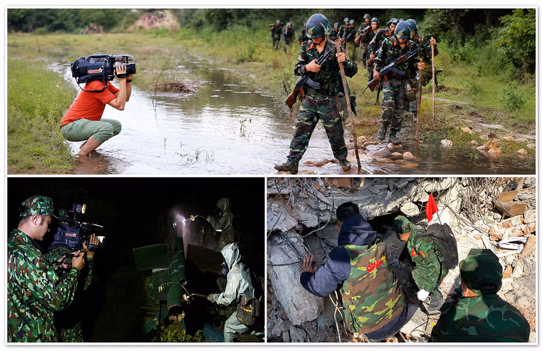 Các phóng viên Truyền hình Quốc phòng Việt Nam tác nghiệp tại hiện trường.