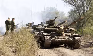 Các bên xung đột tại Ukraine rút vũ khí hạng nhẹ