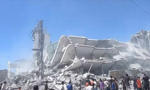Tòa nhà bị phá hủy sau các cuộc không kích của Israel xuống Dải Gaza. Ảnh: IRNA/TTXVN