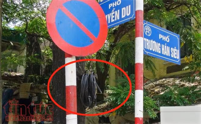 Cáp viễn thông nhằng nhịt, gây nguy hiểm cho người đi bộ ảnh 9