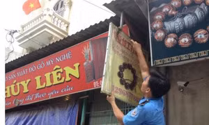 Xử lý trách nhiệm địa phương không dỡ biển quảng cáo vi phạm