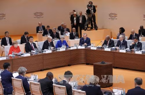 Các nước G20 thỏa hiệp về thương mại, bất đồng về chống biến đổi khí hậu ảnh 1