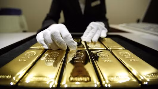 Vàng mất giá sau quyết sách của FED ảnh 1
