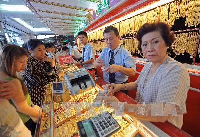 Giá vàng chạm mức cao nhất gần một tháng ảnh 1