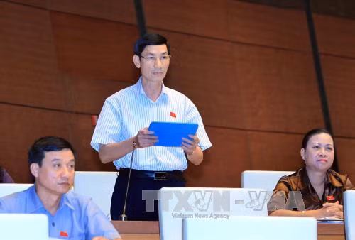 Thông qua Nghị quyết về Quyết toán ngân sách năm 2013 ảnh 1