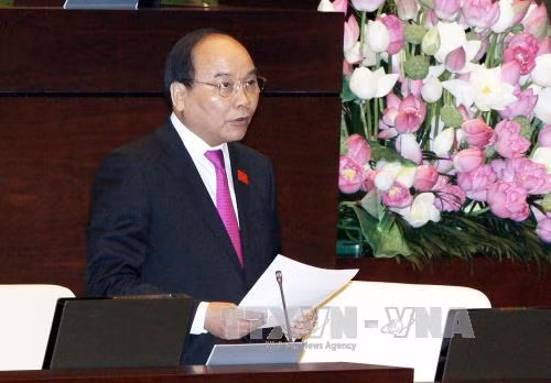 Phó Thủ tướng Nguyễn Xuân Phúc trả lời chất vấn Quốc hội ảnh 1