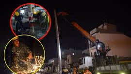 Nhóm công nhân xuyên đêm thu hồi trụ điện trên đường Dương Quảng Hàm (quận Gò Vấp).