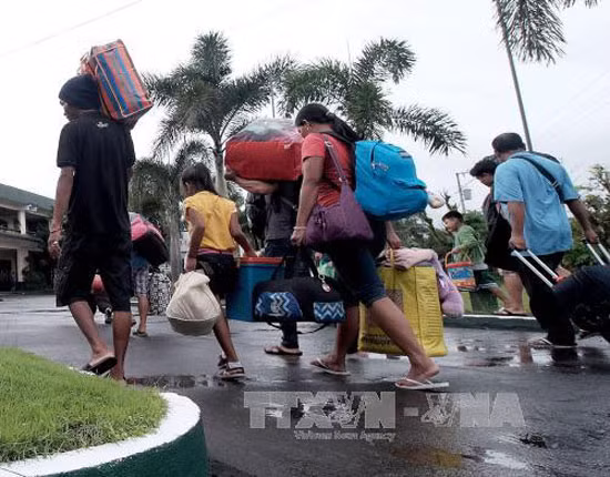 Bão Nock-Ten suy yếu sau khi quét qua Philippines ảnh 1