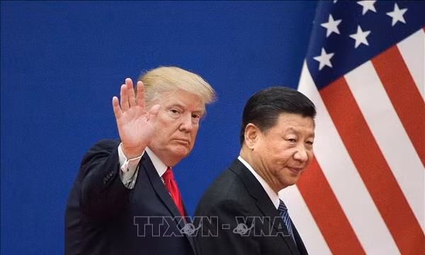 Tổng thống Mỹ Donald Trump (trái) và Chủ tịch Trung Quốc Tập Cận Bình trong một cuộc gặp năm 2017. Ảnh tư liệu: AFP/TTXVN (Không sử dụng, chia sẻ bởi bên thứ ba)
