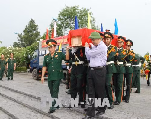 Truy điệu các hài cốt liệt sỹ là quân tình nguyện và chuyên gia Việt Nam hy sinh tại Lào ảnh 1