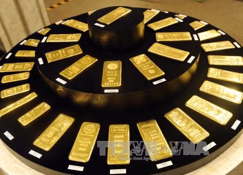 Giá vàng thế giới đi xuống trước sự tăng giá của đồng USD ảnh 1