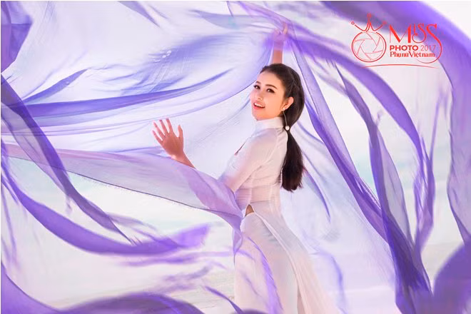 Ngắm vẻ đẹp thanh khiết của thí sinh Miss Photo cùng áo dài trước biển ảnh 20