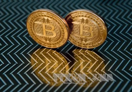 Giá trị đồng tiền ảo Bitcoin vượt mốc kỷ lục 10.000 USD ảnh 1