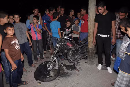 Israel không kích Gaza trả đũa vụ bắn rốckét ảnh 1