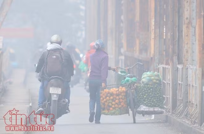Hà Nội lãng đãng trong sương mờ buổi sớm ảnh 8