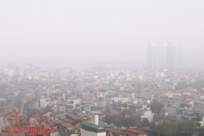 Hà Nội lãng đãng trong sương mờ buổi sớm ảnh 17