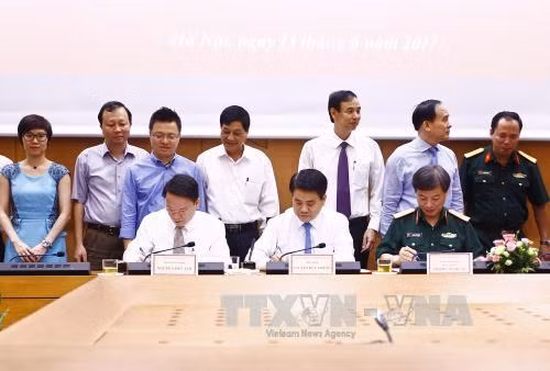 UBND TP Hà Nội và TTXVN ký kết Chương trình phối hợp công tác giai đoạn 2017-2021 ảnh 1