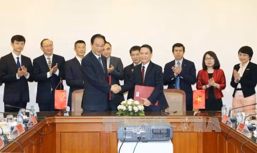 Thông tấn xã Việt Nam và Tân Hoa xã ký Thỏa thuận hợp tác mới ảnh 1
