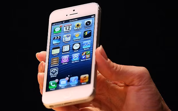 Mãi lực iPhone 5 yếu, cổ phiếu ăn theo giảm mạnh ảnh 1