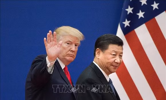 Tổng thống Mỹ Donald Trump (trái) và Chủ tịch Trung Quốc Tập Cận Bình trong một cuộc gặp năm 2017. Ảnh tư liệu: AFP/TTXVN (Không sử dụng, chia sẻ bởi bên thứ ba)
