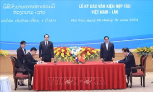 Hai Thủ tướng chứng kiến Lễ ký các văn kiện hợp tác Việt Nam - Lào