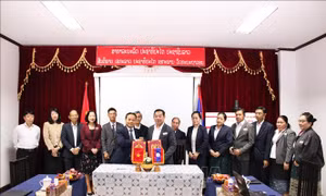 Tăng cường hợp tác giữa báo Nhân Dân và báo Pasaxon của Lào