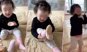 Bé gái 2 tuổi gây xúc động vì khoảnh khắc tự đeo chân giả