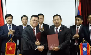 Lãnh đạo Lào đánh giá cao hiệu quả hợp tác giữa báo Nhân dân và báo Pasaxon 