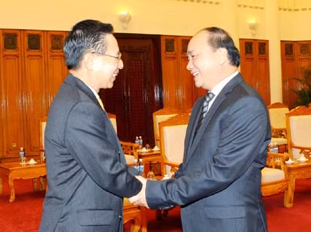 Phó Thủ tướng Nguyễn Xuân Phúc tiếp Bộ trưởng Bộ Công Thương Lào ảnh 1