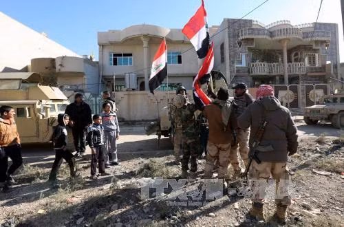 Iraq giành lại 31 quận ở Mosul, ông Carter bất ngờ tới Baghdad ảnh 1