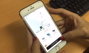 Grab thâu tóm Uber có vi phạm Luật Cạnh tranh?