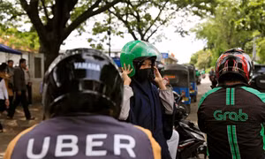 Uber bị Grab thâu tóm tại Đông Nam Á, lái xe và khách hàng lo ít lựa chọn