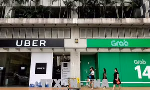 Hội đồng Cạnh tranh: Vụ Grab mua lại Uber không vi phạm Luật Cạnh tranh