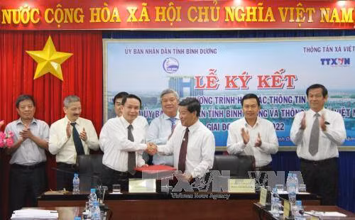 Đẩy mạnh hợp tác thông tin giữa TTXVN và UBND tỉnh Bình Dương ảnh 1