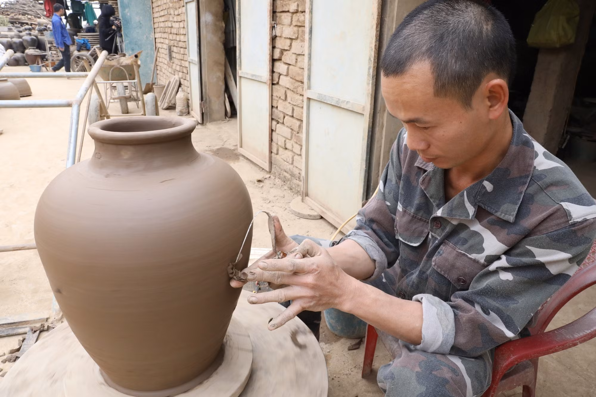 potal-ninh-binh-lang-gom-gia-thuy-giu-lua-xuyen-tet-7825332.jpg