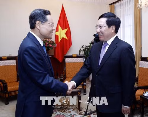 Phó Thủ tướng Phạm Bình Minh tiếp Chủ tịch Chính quyền Khu tự trị dân tộc Choang Quảng Tây ảnh 1
